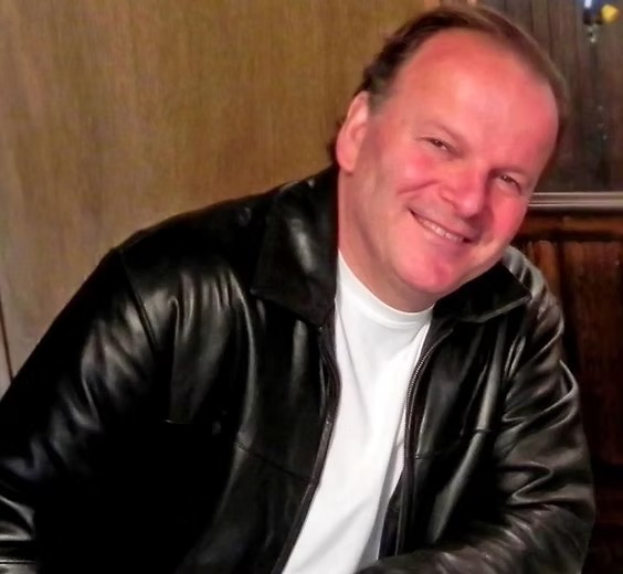 Robert Clohessy as John McLean in Living with the Dead: A Love Story